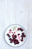 Cherries and cherry stones on a plate