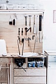 Workbench with tools hung on wooden plate