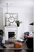 Traditional living room with fireplace and stucco rosette, dog on couch