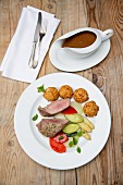 Pork fillet with vegetables and croquettes