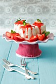 Yoghurt puddings with lime and strawberry sauce