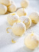 White chocolate truffles with lemon zest and icing sugar