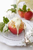 Oven-baked apples with almond cream, apricot jam and vanilla sauce