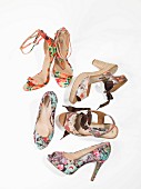Various high-heeled shoes with floral summer prints