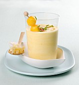 A mango yoghurt smoothie in a glass