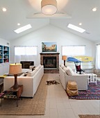 Back-to-back sofas in living room with gable ceiling