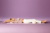 Return lying down: lie on your back, arms above your head