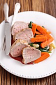 Pork loin with carrots, spinach and cherry sauce