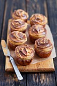 Vanilla muffins with peanut butter and chocolate cream