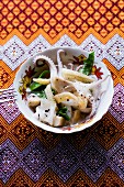 Rad Nah Pla Mük (rice noodles with squid and vegetables, Thailand)