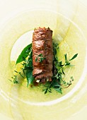 Beef roulade on fresh herbs
