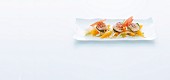 Grilled scallops with fennel and orange salad and Parma ham