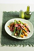 Baked potatoes with green asparagus and strawberry cream