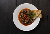 Clams in a spicy tomato broth with crostini