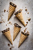Ice cream cones dipped in chocolate and brittle