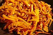 Grated butternut squash fried in olive oil with garlic and herbs