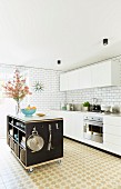 Mobile kitchen island with shelves in white kitchen