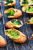 Grilled baguette slices with wild garlic pesto