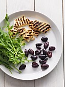 Olives, grilled cheese and rocket