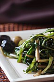 Sautéed dandelions in olive oil (close-up)