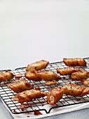 Slices of fried potato gratin on a wire rack