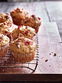 Squash and cranberry muffins on a wire rack