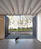 Minimalist interior with concrete floor and terrace doors