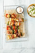Chicken and vegetable kebabs with a spicy yoghurt dip