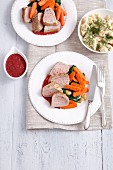 Pork loin with spinach, carrots, cherry sauce and dill Spätzle (soft egg noodles from Swabia)