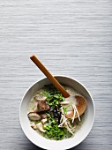 Vegetarian ramen soup with mushrooms, ramen noodles, algae, mung bean sprouts and bok choy