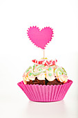 Cup cake with heart decoration
