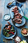 Grilled steak with spices and side dishes (Mexico)
