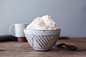 Whipped cream in a ceramic bowl