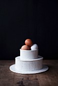 Chickens eggs in a two-tier porcelain container