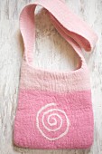 Hand-made pink felt bag with spiral motif