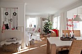 Christmas tree and Advent centrepiece in open-plan living area with Scandinavian ambiance