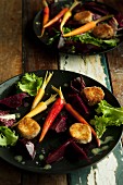 Breaded, baked cheese fritters with beetroot and carrots