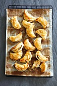 Puff pastry moons filled with lentils and raisins