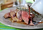 Grilled lamb with gravy and rosemary