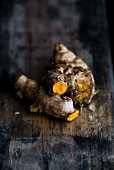 Turmeric roots on a wooden surface