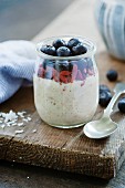 Overnight oats, soaked in coconut milk with blueberries and goji berries