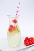 Raspberry and lime lemonade in a glass bottle