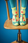 Socks decorated with colourful spots of paint