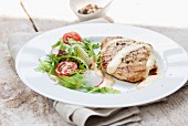 Grilled turkey breast with Hollandaise sauce and a side salad