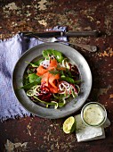 Salad with vegetable spirals, spinach and smoked salmon