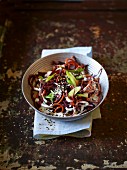 Carrot spaghetti with spring onions and sesame seeds