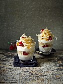 Layered desserts with apple spirals and raspberries