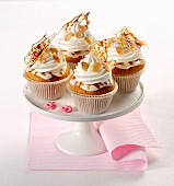 Almond cupcakes with caramel and cream