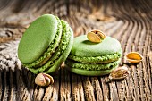Green pistachio macaroons on a wooden table