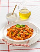 Maccheroni alla nduja (pasta with tomato sauce, spicy sausage and basil, Italy)